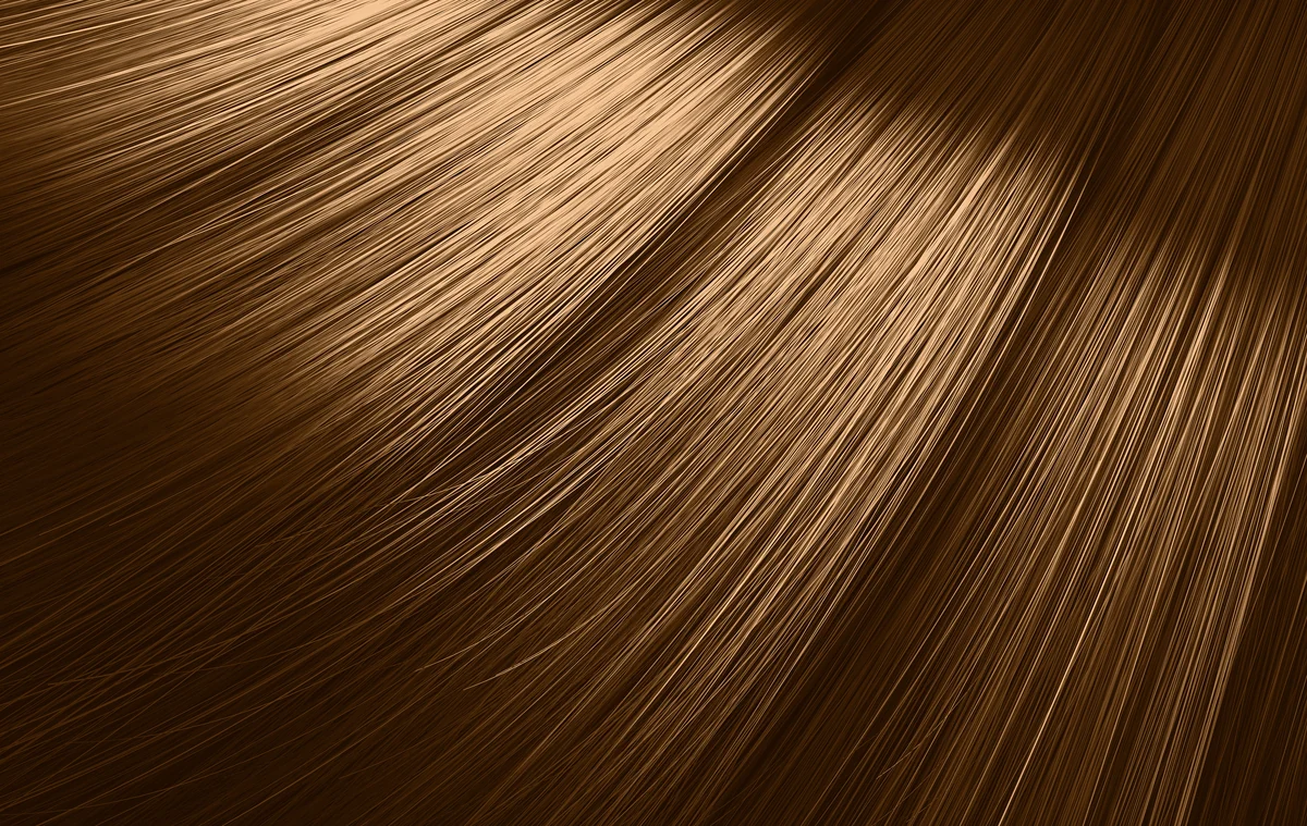 Close-up of thick, healthy-looking hair representing DE|RIVE hair restoration at Pure Body Health in South Tempe, AZ
