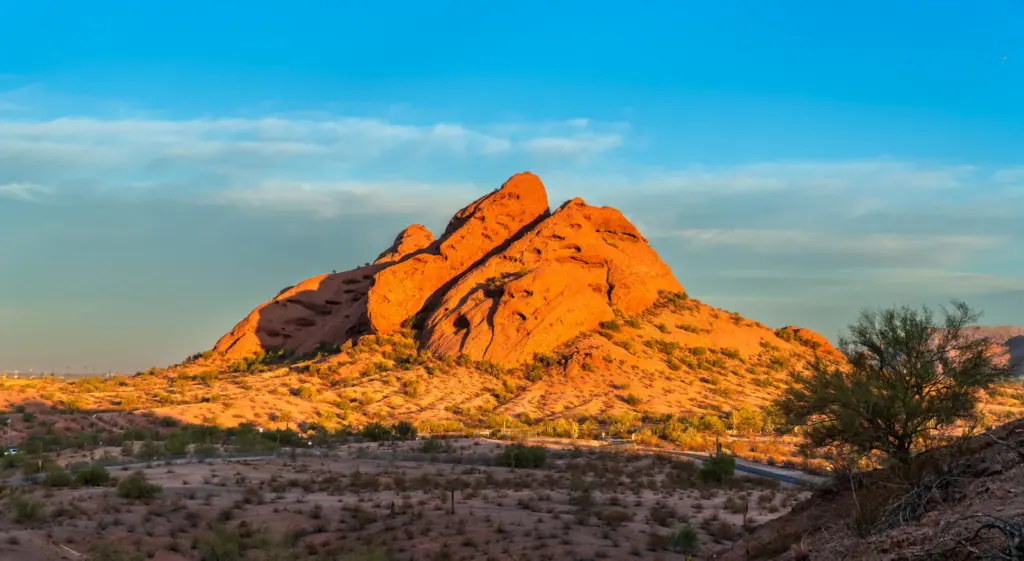 Red sandstone buttes of Papago Park glowing at sunset, a desert landmark on the Tempe and Phoenix border.